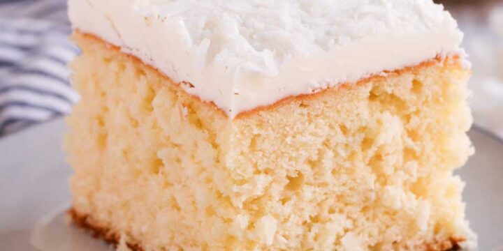coconut cake with coconut butter cream on a plate