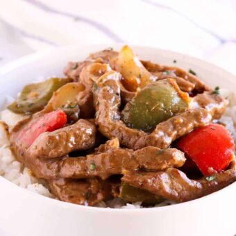 Beef strips sauteed with pepper in a bowl of rice