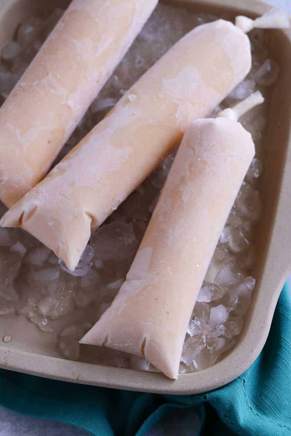 custard icicles on a bed of ice, close up shot