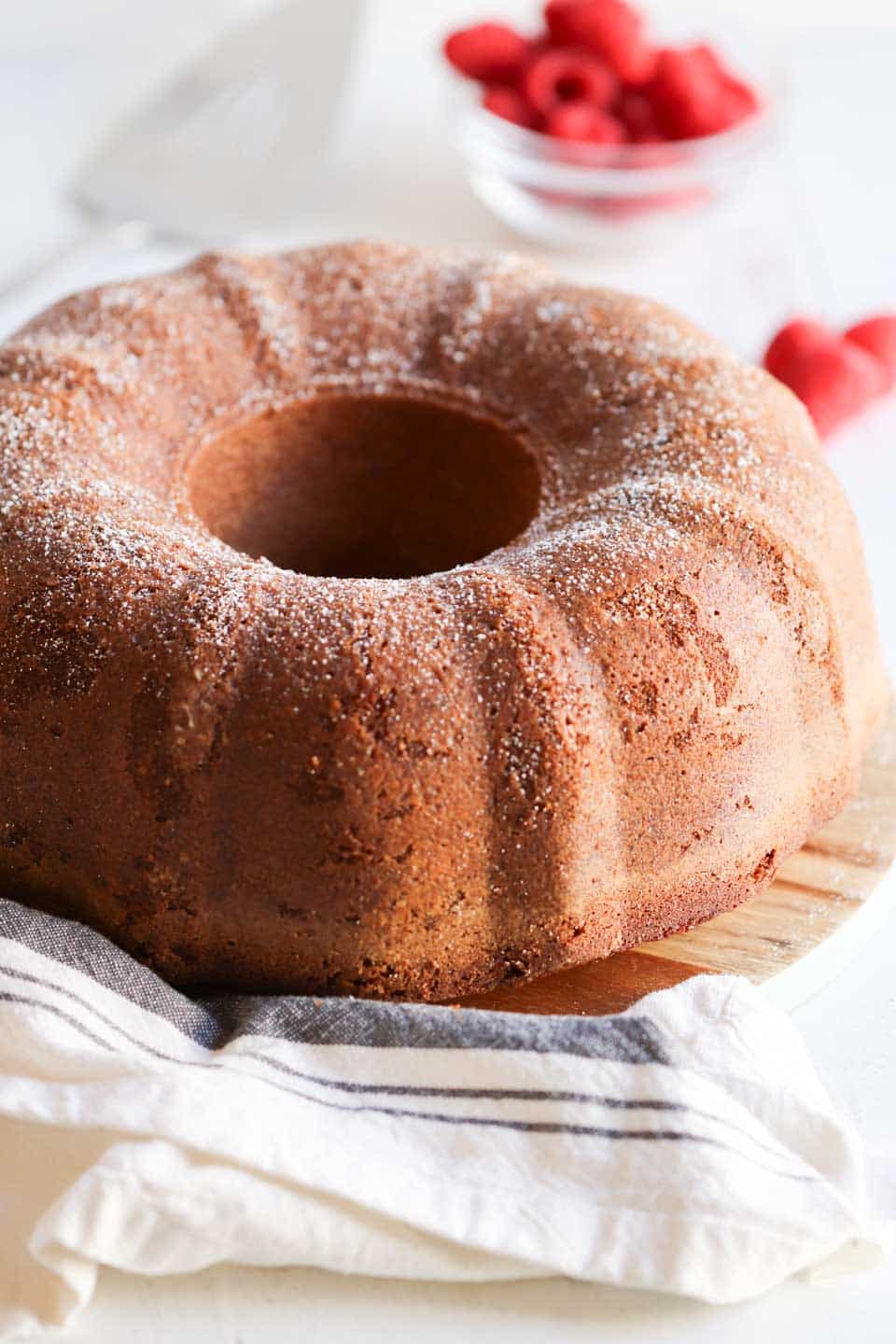 a whole white chocolate bundt cake dusted with powdered sugar