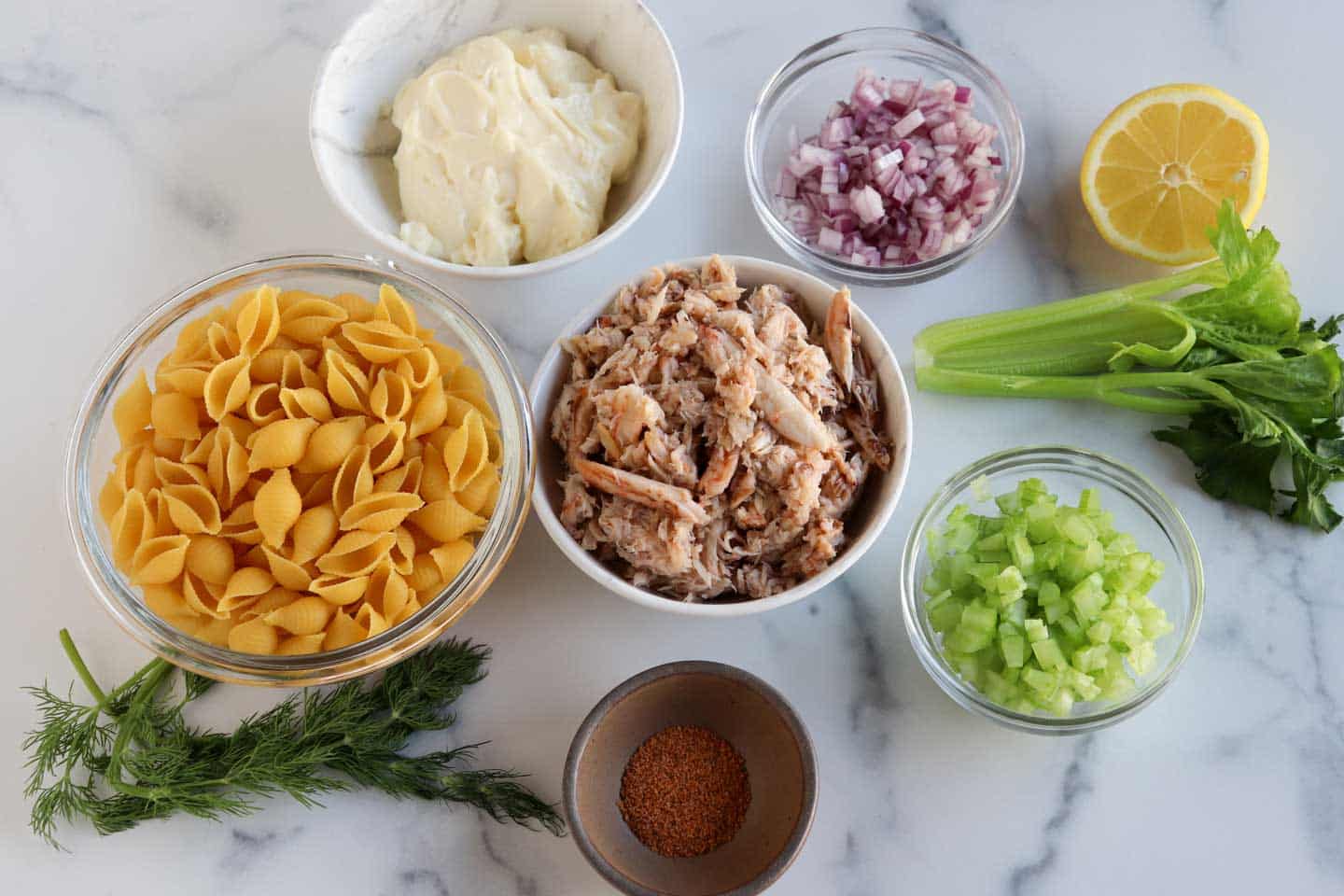 overhead shot of ingredients for a crab pasta salad