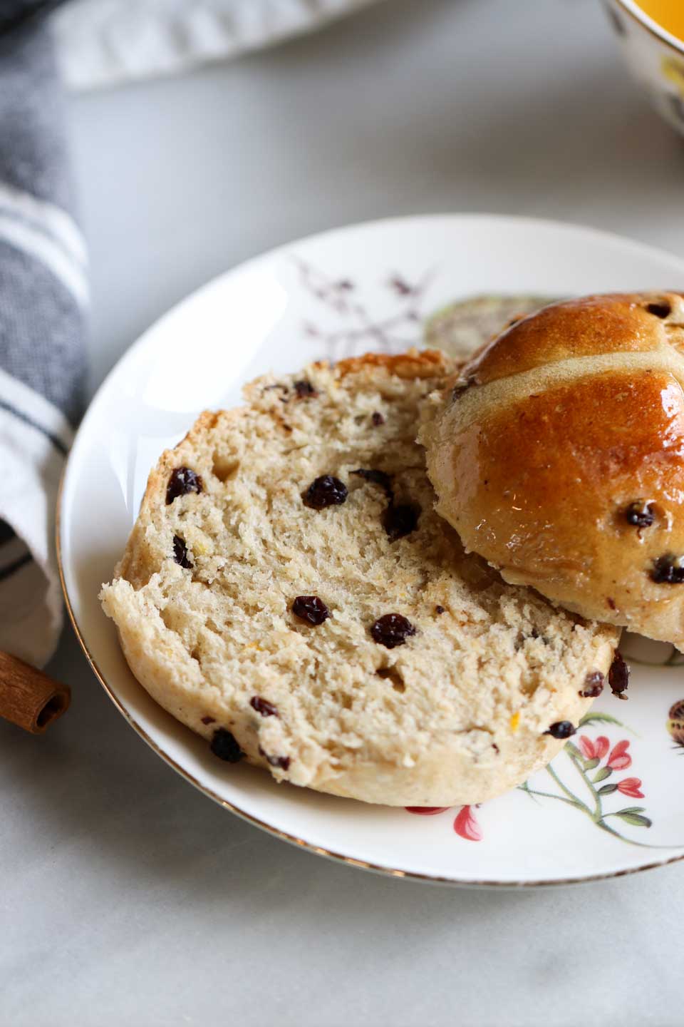 Eggless Hot Cross Buns with currants, orange zest and warm cinnamon.  