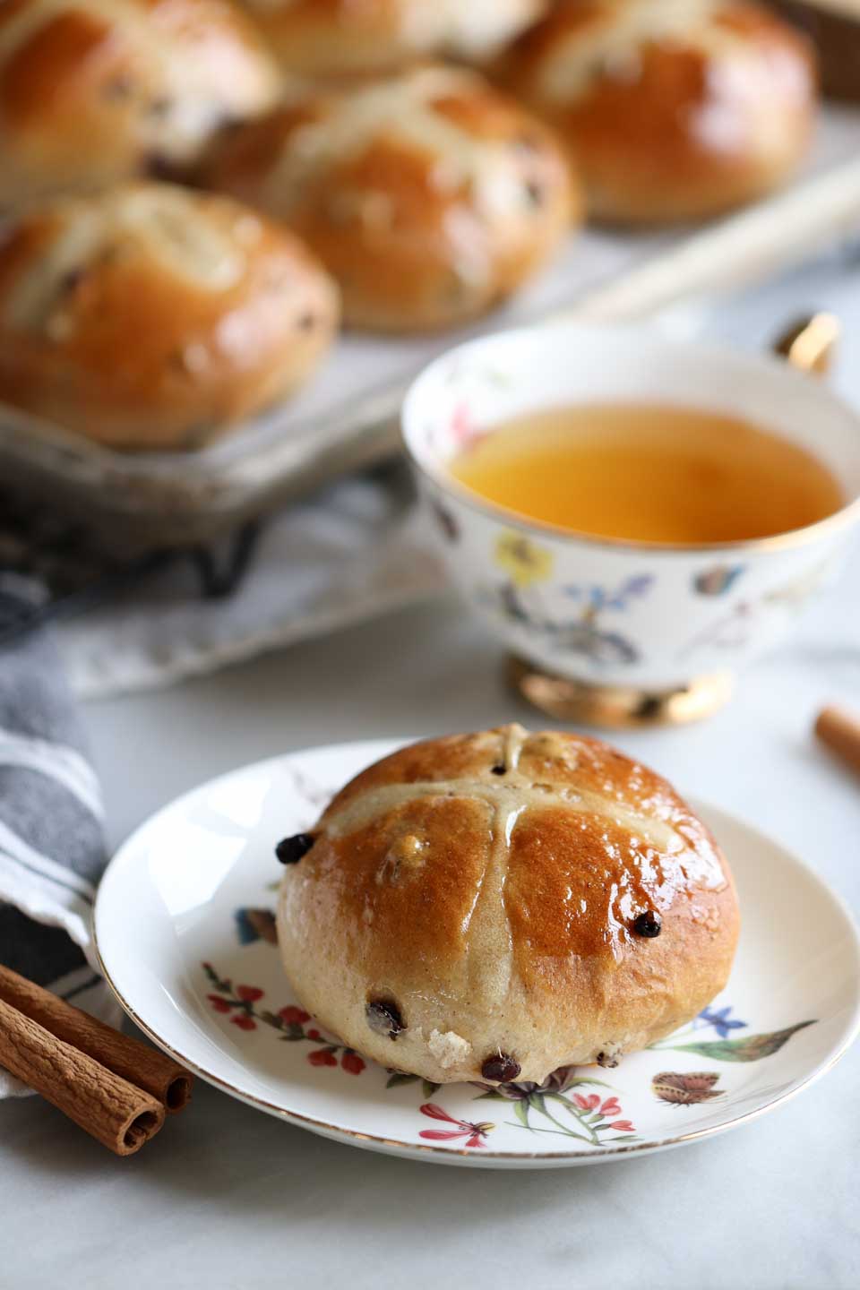 Eggless Hot Cross Buns - a spiced bun with cinnamon, cloves and currants.  An Easter favorite.