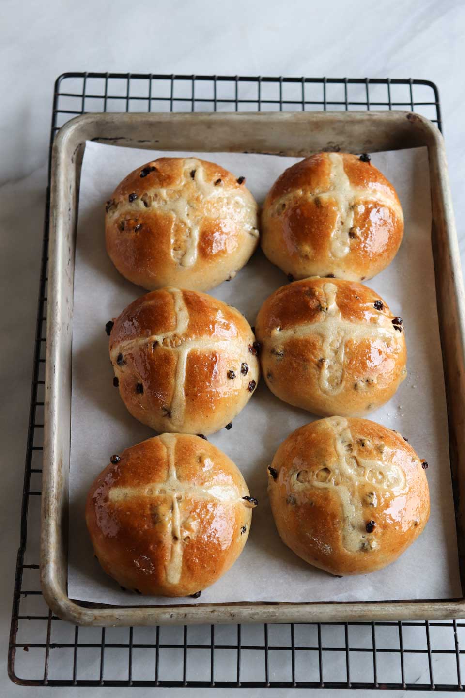Classic Easter buns with traditional spices like clove, cinnamon and orange zest made eggless